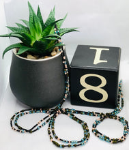 Load image into Gallery viewer, “Must Have” Tie on Waist Beads with Black, Blue, Green &amp; Cream Beads
